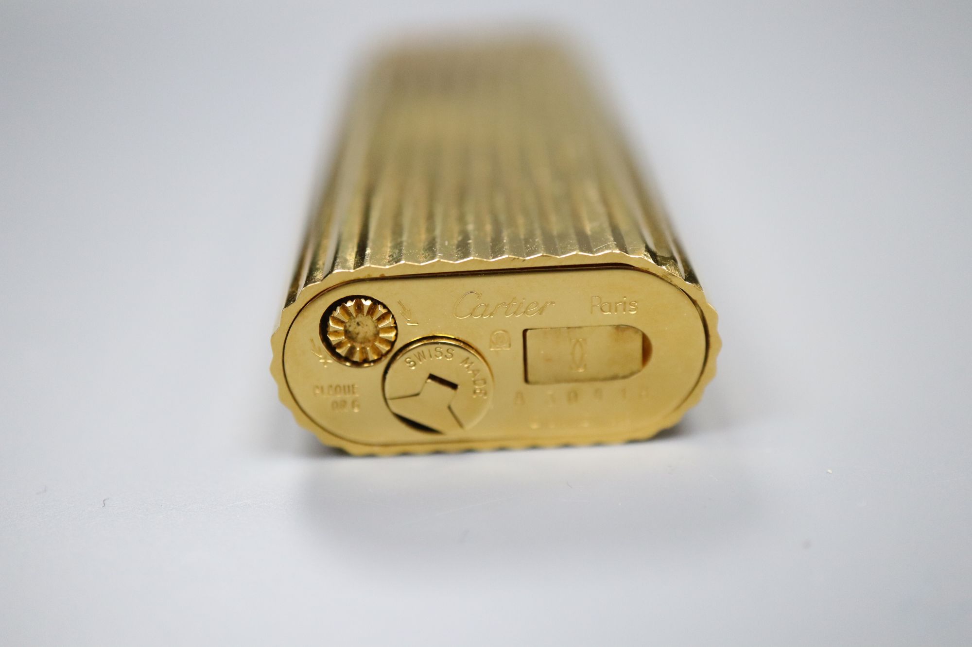 A cased Must de Cartier gold plated lighter
